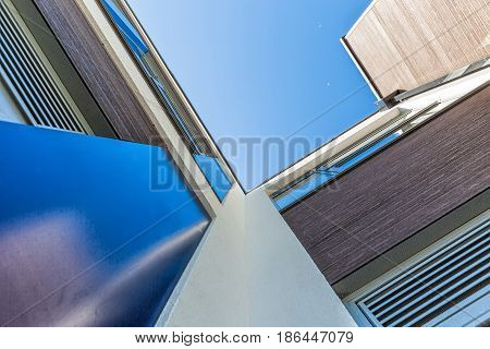 Disappearing glass office buildings in the morning wide angle view