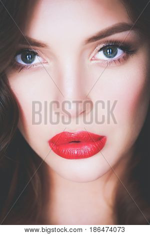 Beautiful woman skin with red lips on white background
