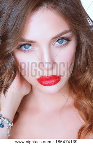 Beautiful woman skin with red lips on white background