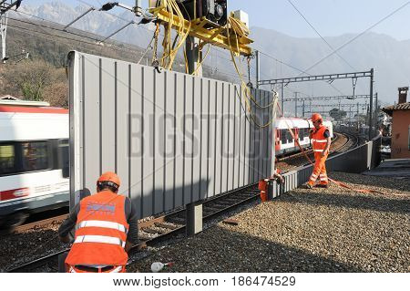 Workers During The Installation Of Noise Barriers On The Railway