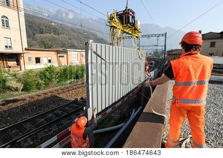 Workers During The Installation Of Noise Barriers On The Railway