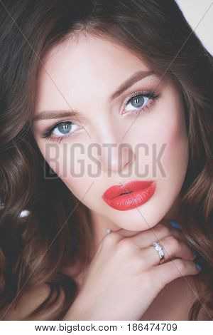 Beautiful woman skin with red lips on white background