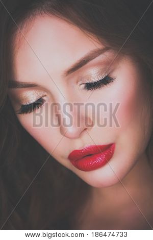 Beautiful woman skin with red lips on gray background
