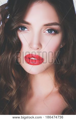 Beautiful woman skin with red lips on white background