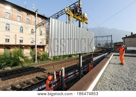 Workers During The Installation Of Noise Barriers On The Railway