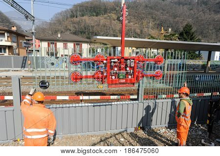 Workers During The Installation Of Noise Barriers On The Railway