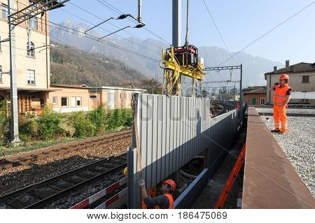 Workers During The Installation Of Noise Barriers On The Railway