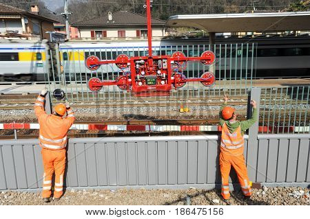 Workers During The Installation Of Noise Barriers On The Railway