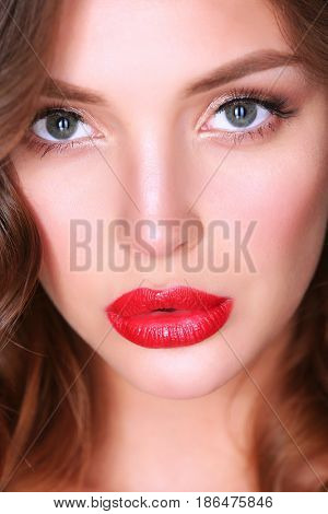 Beautiful woman skin with red lips on white background
