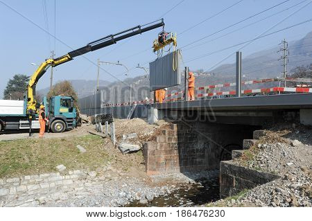 Workers During The Installation Of Noise Barriers On The Railway