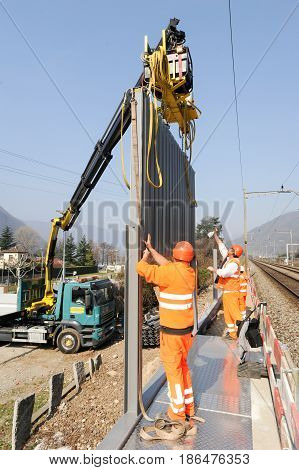 Workers During The Installation Of Noise Barriers On The Railway