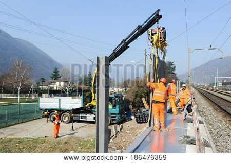 Workers During The Installation Of Noise Barriers On The Railway