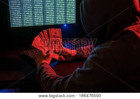 Cyber Criminal Calculates Revenue From Extortion Or A Virus Program.