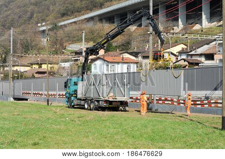 Workers During The Installation Of Noise Barriers On The Railway