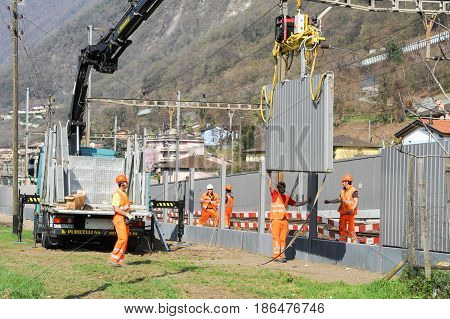 Workers During The Installation Of Noise Barriers On The Railway