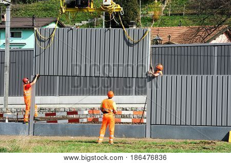 Workers During The Installation Of Noise Barriers On The Railway