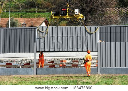 Workers During The Installation Of Noise Barriers On The Railway