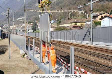 Workers During The Installation Of Noise Barriers On The Railway