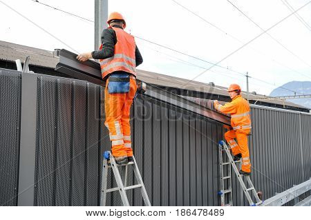 Workers During The Installation Of Noise Barriers On The Railway
