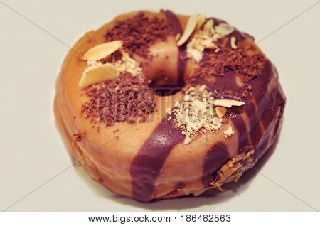 Vintage tint doughnut on white background. Unappetizing food