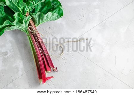 Fresh Organic Rhubarb On Grey Concrete Background