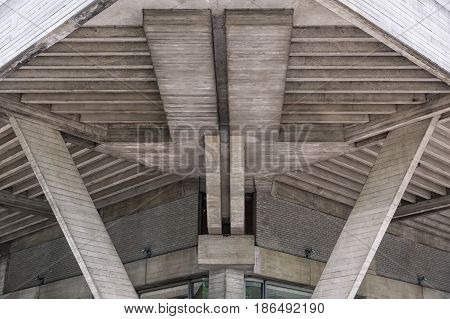 London England - June 2015: Frontal view of a robust concrete building in the city. Constructed during the brutalism momevent. A stark style of functionalist architecture especially of the 1950s and 1960s characterized by the use of steel and concrete in
