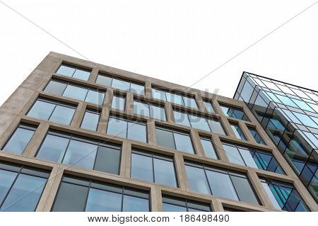 Cardiff England - March 2016: Disappearing glass office buildings in the morning wide angle view. Stone cladded facade with blue tinted large windows