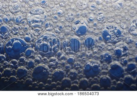 abstract close up of bubbles on blue background