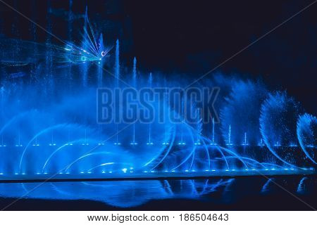 Multicolored Dancing Water Jet Fountain In The Dark
