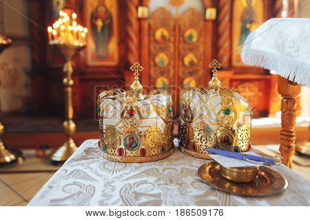 Two beautiful gold wedding crowns in the Church