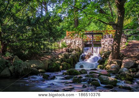WATERFALL - Water dam and bridge in the urban garden