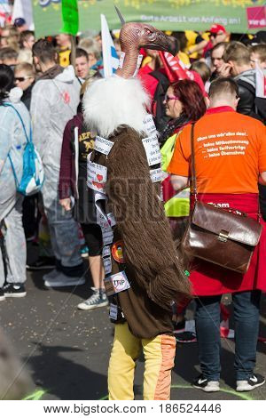 BERLIN - MAY 01 2016: An activist in the neck suit. Members of trade unions workers and employees at the demonstration on the occasion of Labour day.