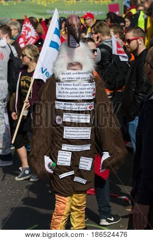 BERLIN - MAY 01 2016: An activist in the neck suit. Members of trade unions workers and employees at the demonstration on the occasion of Labour day.