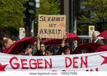 BERLIN - MAY 01 2016: The woman with the poster 