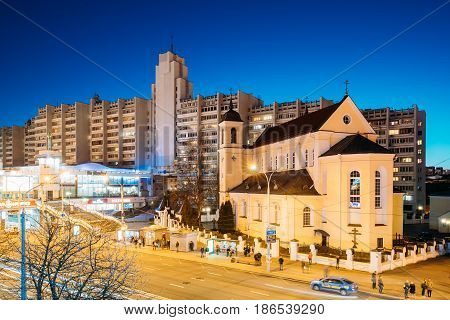Minsk, Belarus - April 3, 2017: Evening Night View Of Cathedral of the Holy Apostles Sts Peter and Paul On Illuminated Nemiga Street. Temple of the Belarusian Exarchate of the Russian Orthodox Church