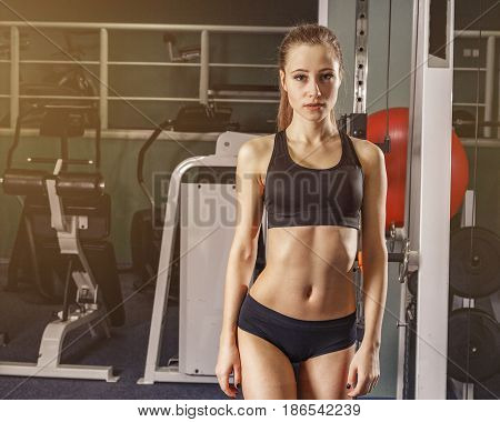 Young woman at the gym exercising beutiful still life