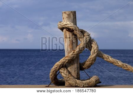 Rope on seafront and sea in sun autumn day. Turkey Erdek coast of Marmara.
