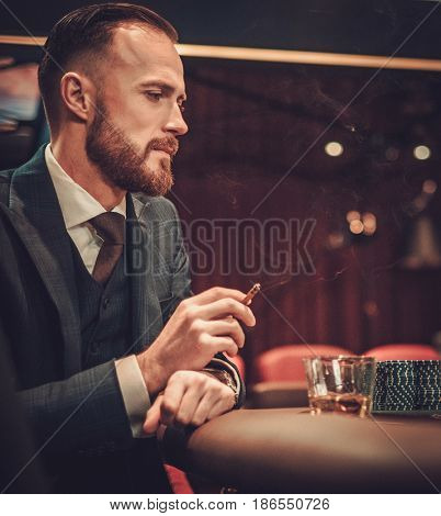 Upper class man gambling in a casino