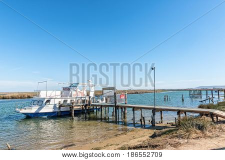 VELDDRIF SOUTH AFRICA - APRIL 1 2017: A coffee shop on a boat at a jetty on the Berg River on Bokkom avenue in Velddrif