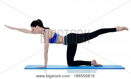one caucasian woman exercising fitness pilates exercices isolated on white background