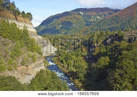 River Truful-Truful running through a deep gorge with colourful eroded cliffs in Conguillio National Park in the Araucania region of Chile