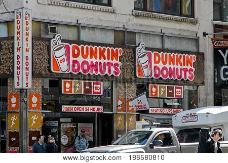 New York May 08 2017: Exterior signs on one of Dunkin Donuts locations in Manhattan.