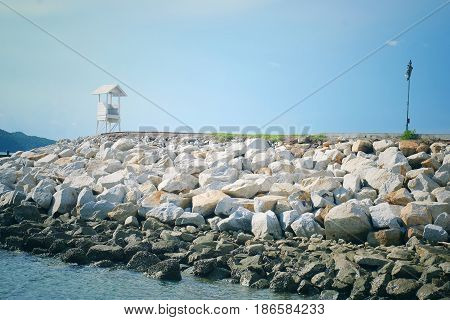 Seascape view of lifeguard tower and wooden bridge in at Khao Leam Ya - Mu Ko Samet, Rayong Thailand