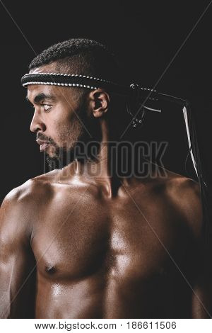 Side View Of Confident Muay Thai Fighter With Mongkhon On Head Isolated On Black