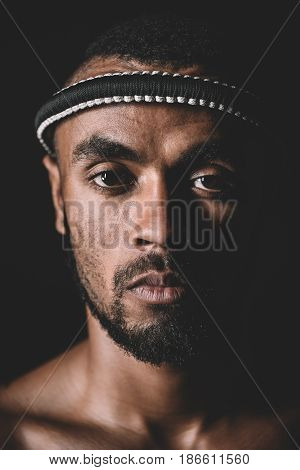 Portrait Of Confident Muay Thai Fighter With Mongkhon On Head Isolated On Black