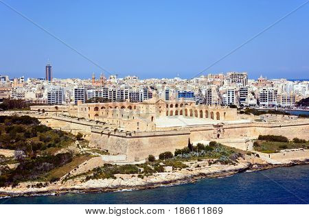 Elevated view of Manoel Fort on Manoel Island seen from Valletta with Sleima to the rear Valletta Malta Europe.