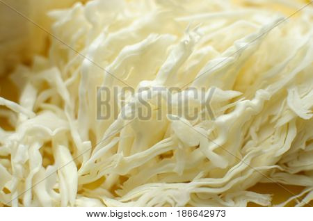 Sliced White Cabbage On A Yellow Cutting Board