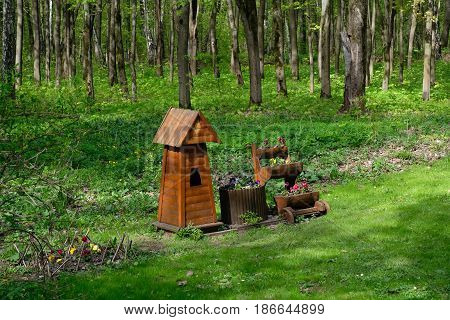 Birdhouse and some flowers near the walkway in Tsaritsyno park, Moscow, Russia