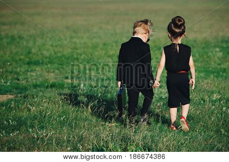 photo of young boy and girl playing spy