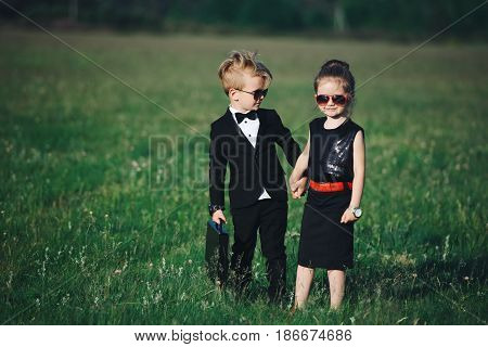 photo of young boy and girl playing spy